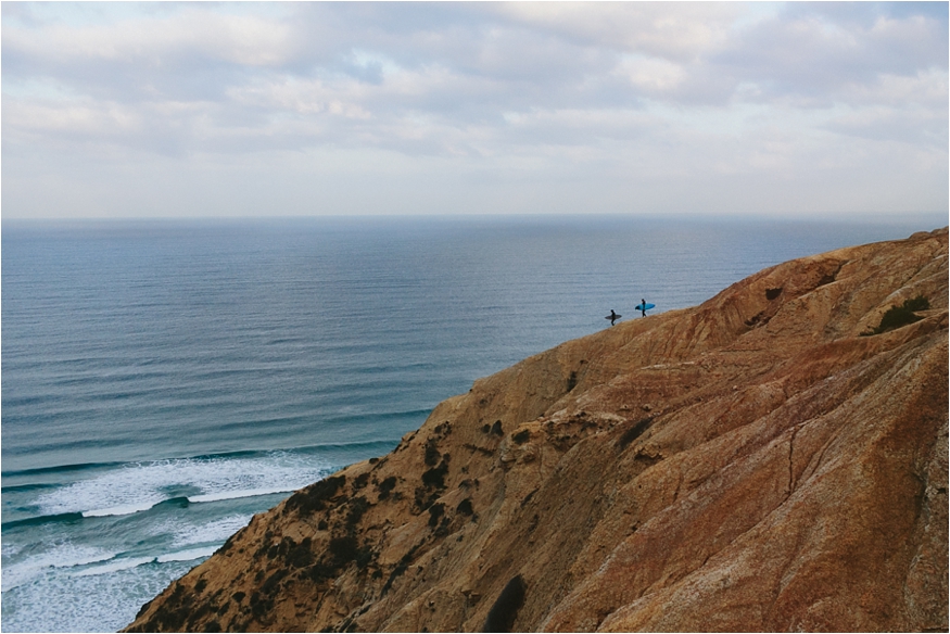 surfers at sunrise in san deigo on the coast