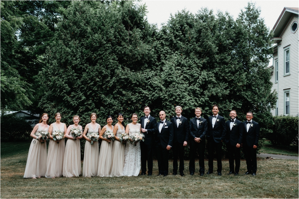 Bridal party in tuxedos and cream bridesmaids gowns. | Lace Tadashi Shoji from BHLDN| Sodus Bay Wedding Photographers | Shaw Photo Co.