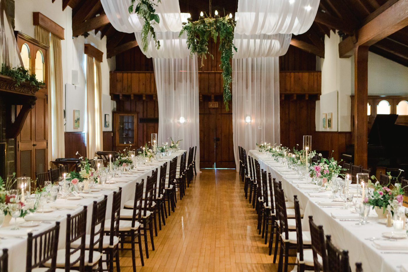 Wedding reception at The Garret Club with white linens and hand picked flowers