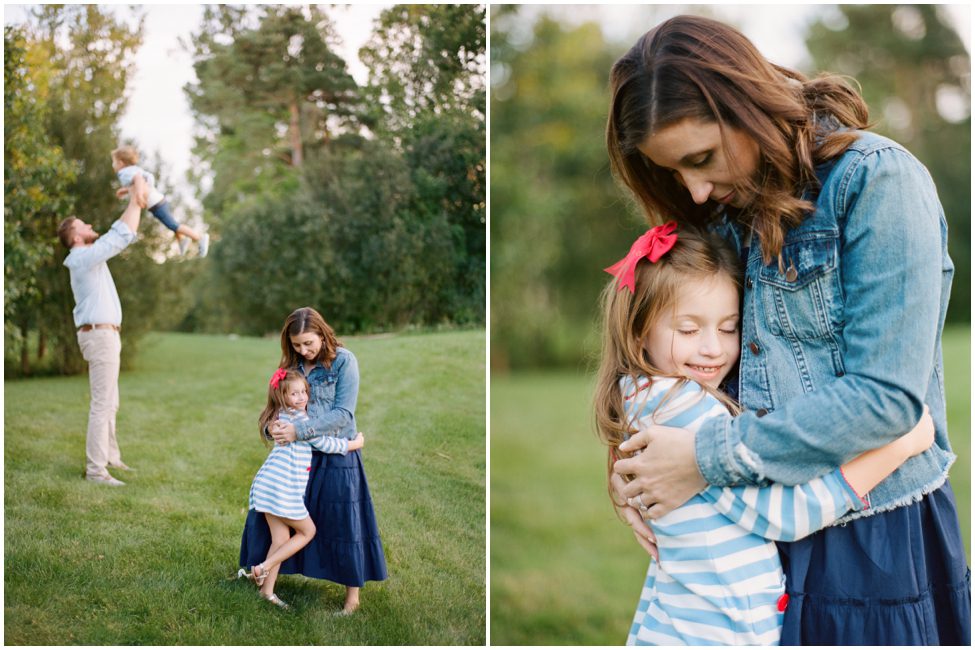 Photo of Mother hugging her daughter while dad plays with son Family Photographers Buffalo New York