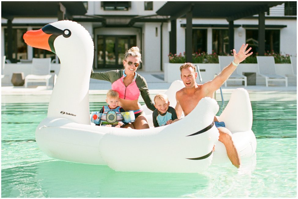 Fun Family Session in Naples Florida swimming on big swan floatie