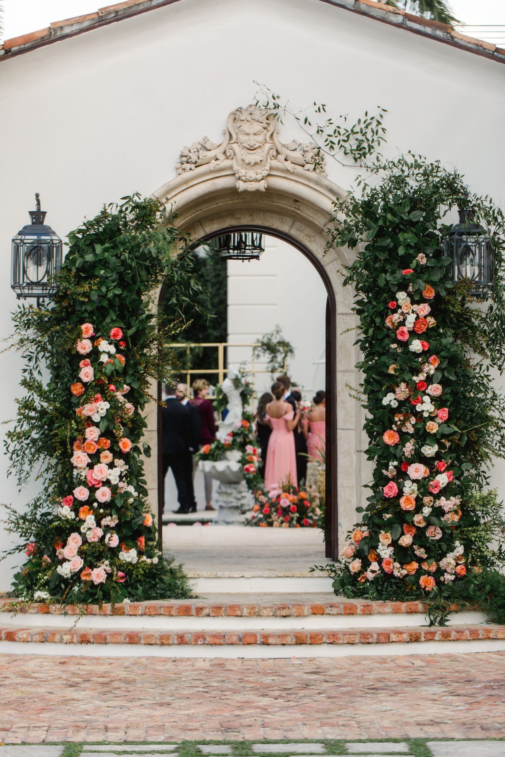 Details of flowers and doorway leading up to Naples Florida Wedding Reception in a backyard