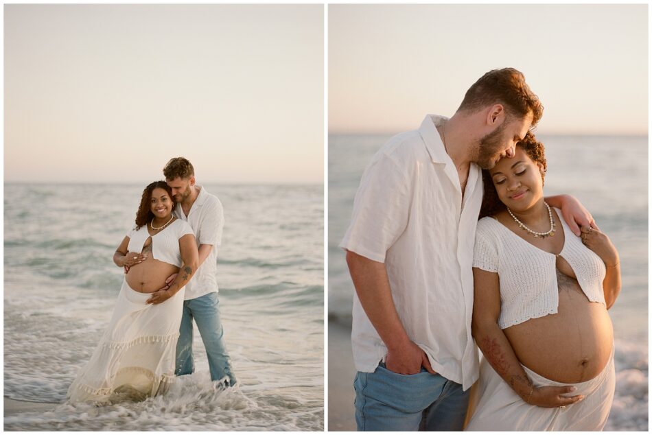 a couple getting maternity photos together at the beach of naples dressed in white