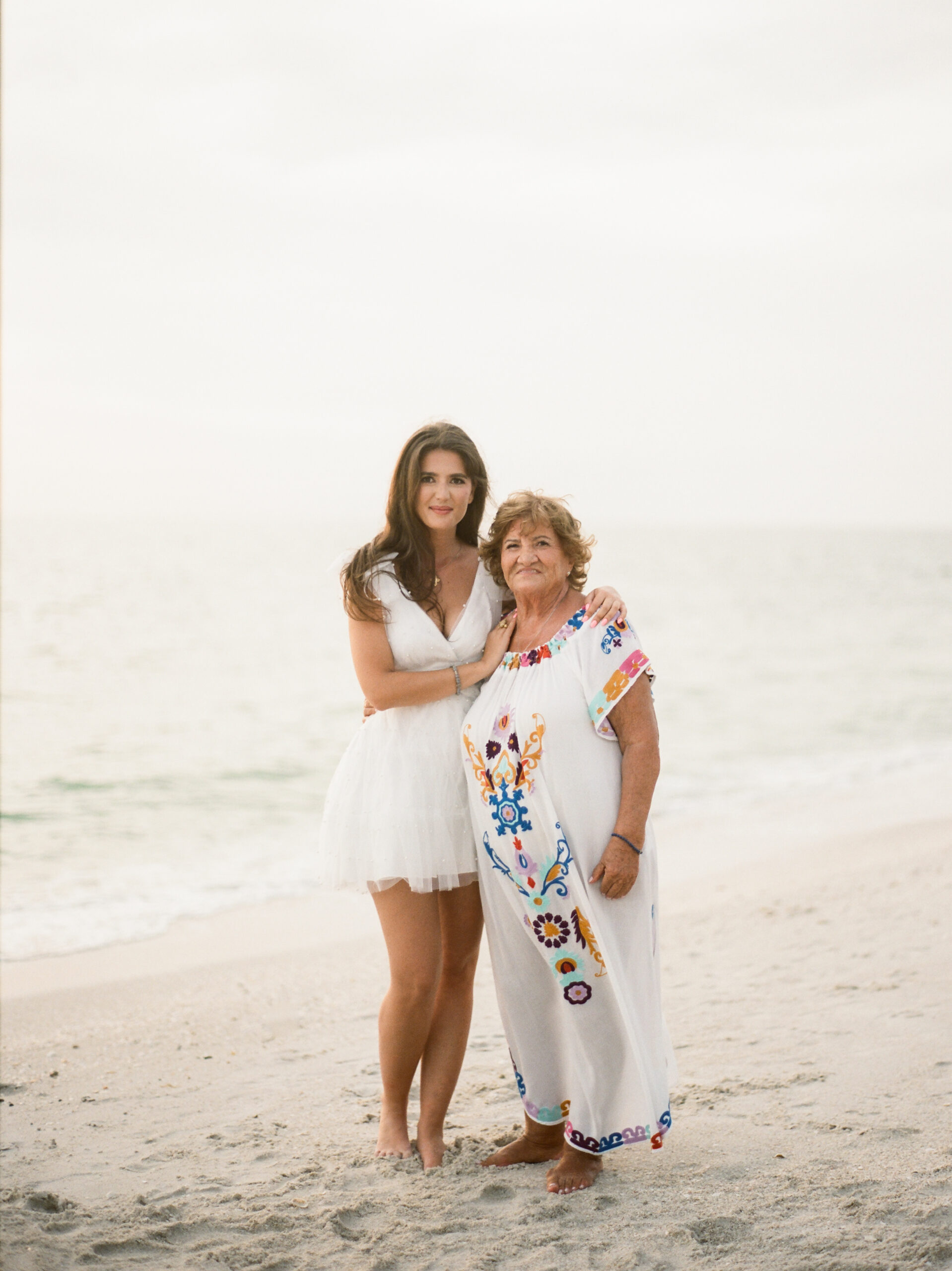 a generational photo of a mother and her grandmother taken at the four seasons Naples
